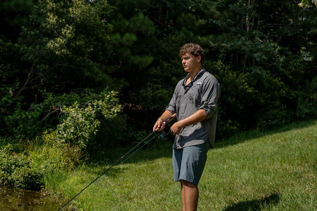 Tommy G casting on a creek bank